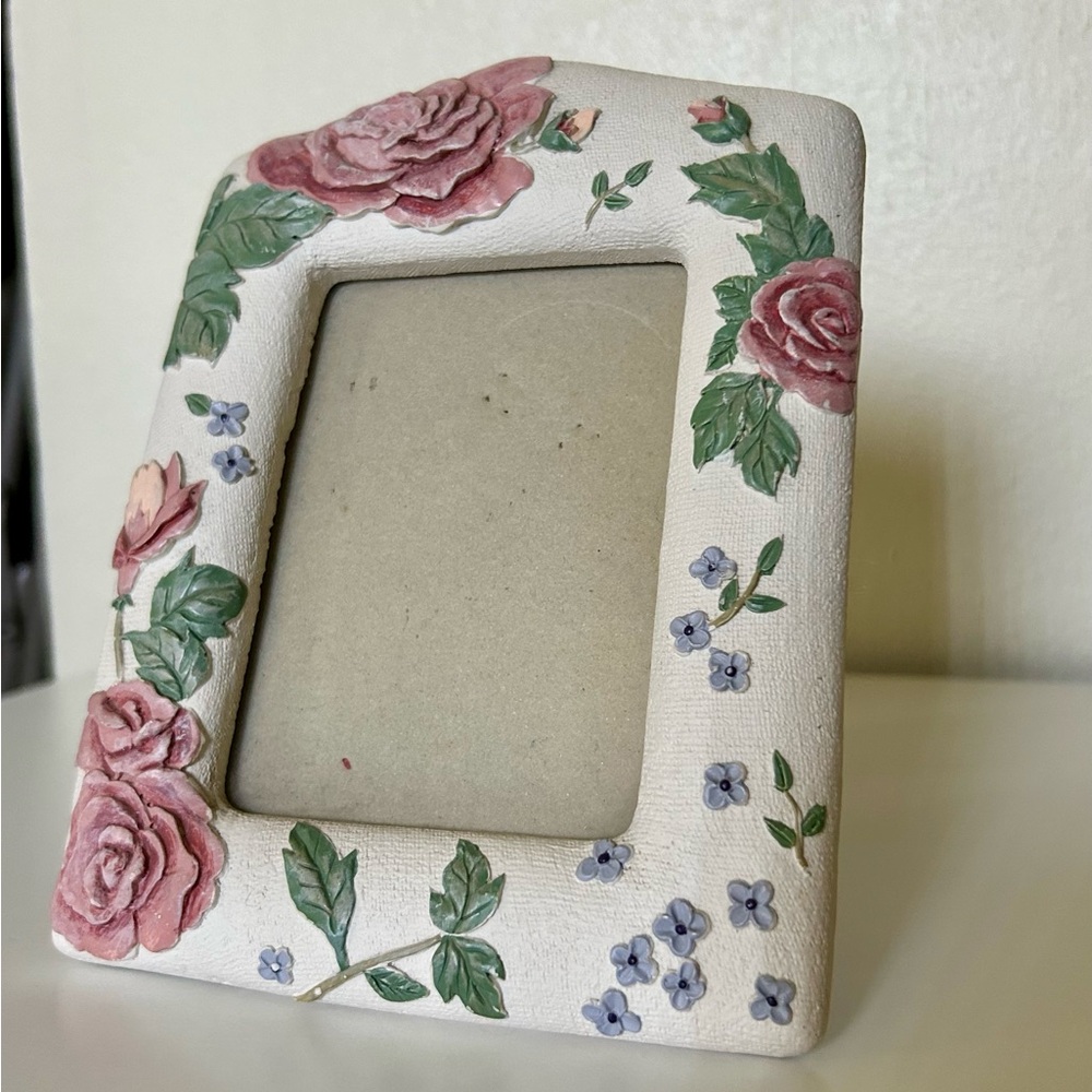 Pink roses, white textured picture frame
